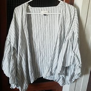 White, blue, and black striped cover